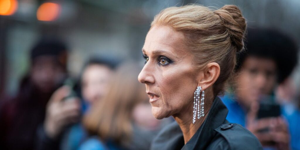 Céline Dion says that almost anything — even happiness — can trigger the symptoms of her stiff-person syndrome