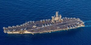 The US Navy carrier strike group fighting off Houthi missiles is staying in the Red Sea for now