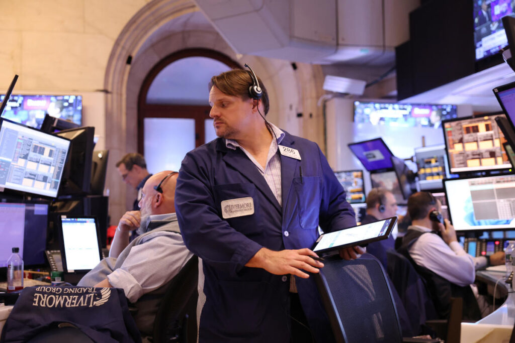 Stock market today: Stocks wobble as investors weigh cooling inflation