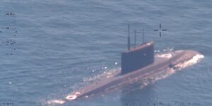 A NATO sub hunter captured these shots of a Russian submarine in waters newly surrounded by the alliance