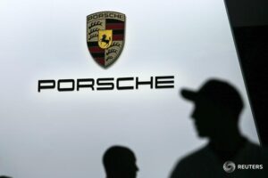 Porsche cuts sales forecast due to alloy shortage; shares tank By Reuters