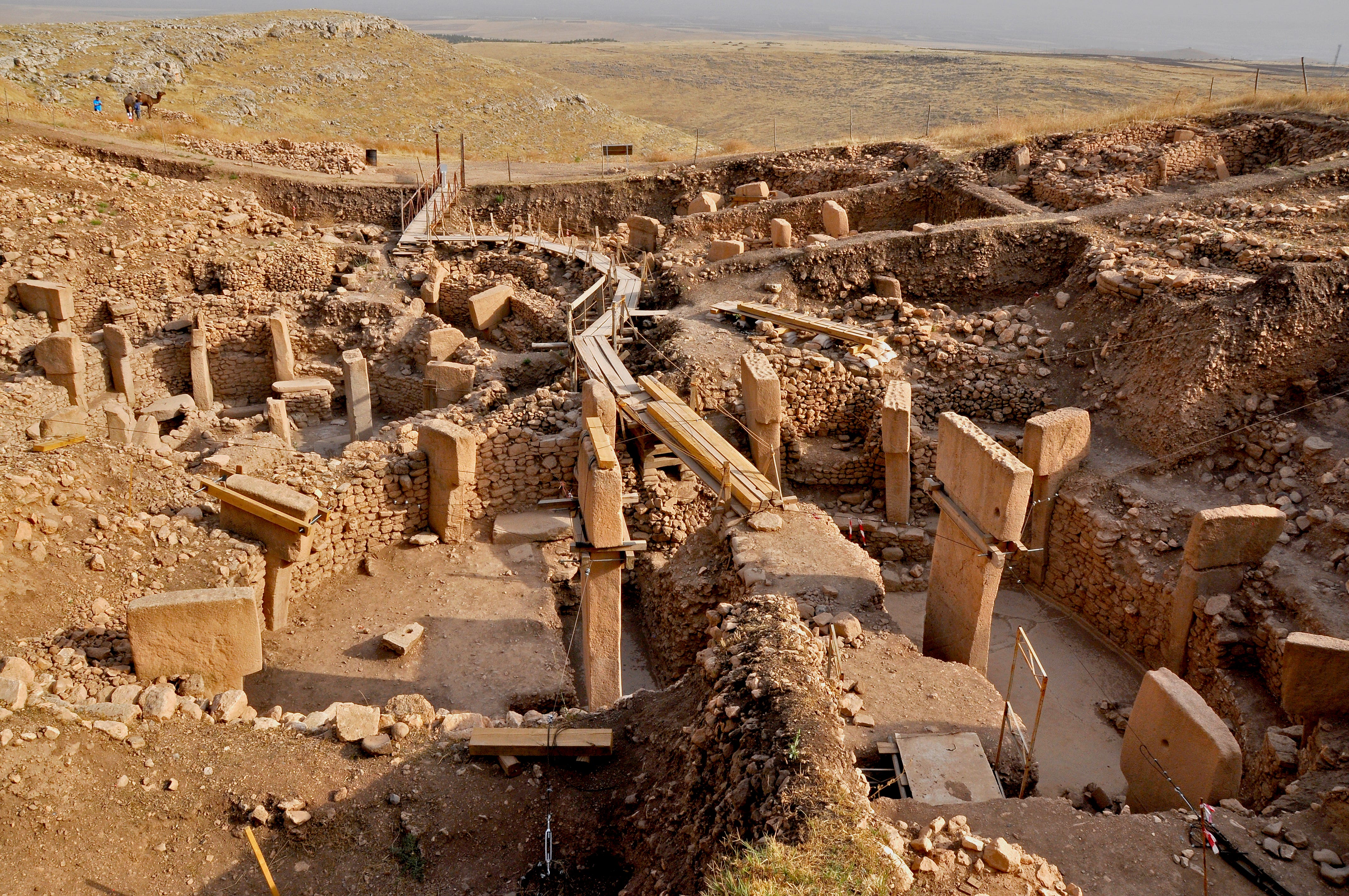 A pathway over an ancient site, Göbekli Tepe, in Turkey with limestone pillars