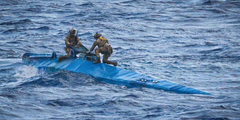 Newly released photos capture British commandos and American forces hunting down a narco-sub carrying 9 million of cocaine in the Caribbean