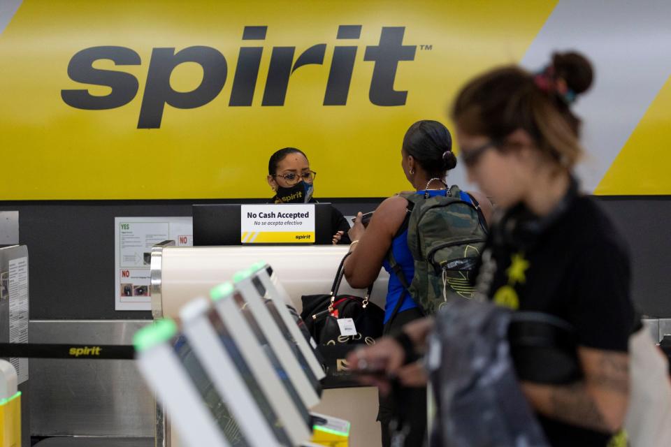 Travelers check-in at the Spirit Airlines counter at Fort Lauderdale-Hollywood International Airport in Fort Lauderdale, Florida, on Oct. 24, 2023.