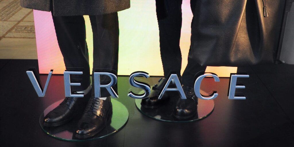 Versace’s parent company stock plunged 45% after an affordable-luxury deal was blocked in court