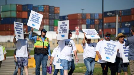 Sources: Striking port workers to return to work Friday as negotiators reach an agreement on wages